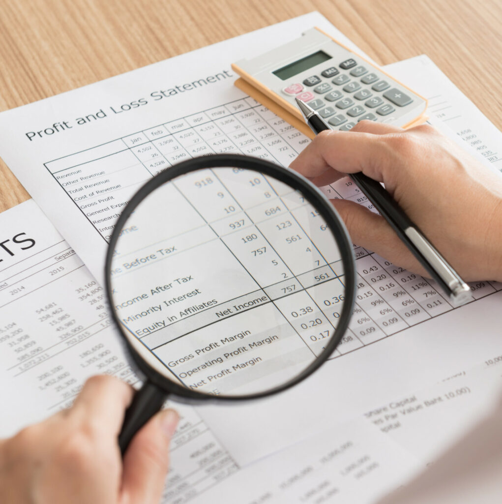 A log of financial data with magnifying glass