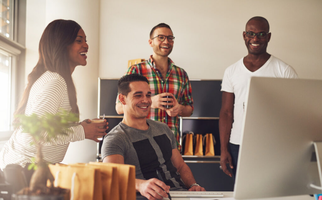 4 people working in an office