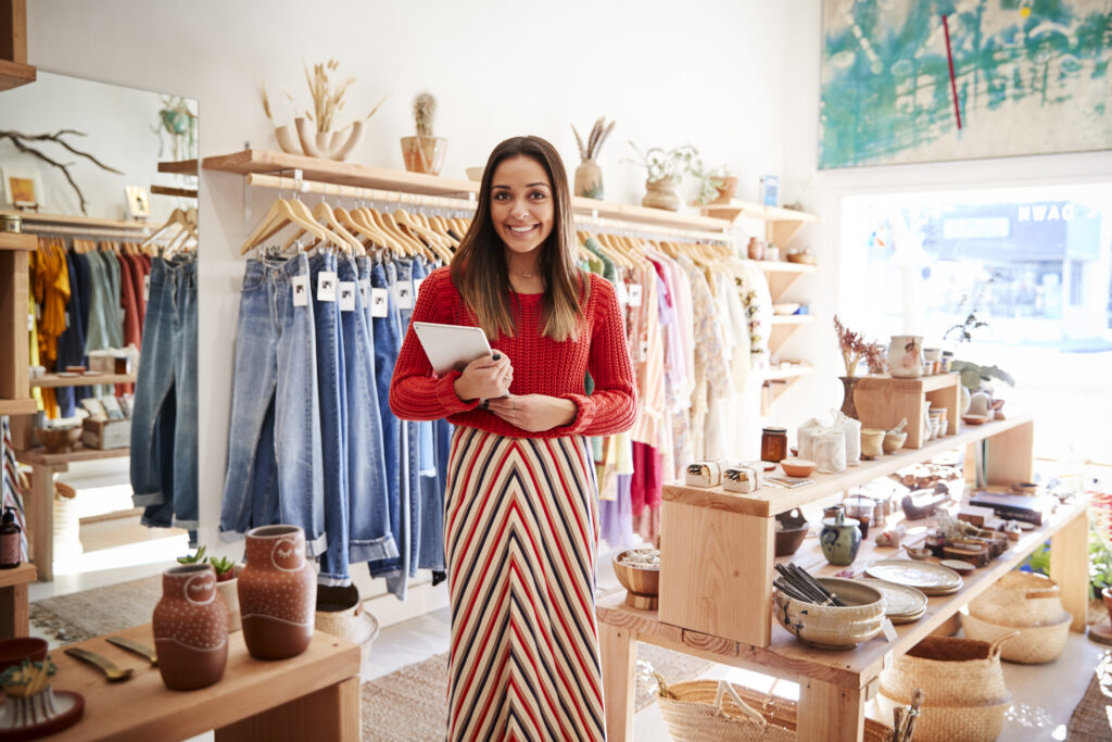 Portrait Of Female Owner Of Independent Clothing And Gift Store With Digital Tablet